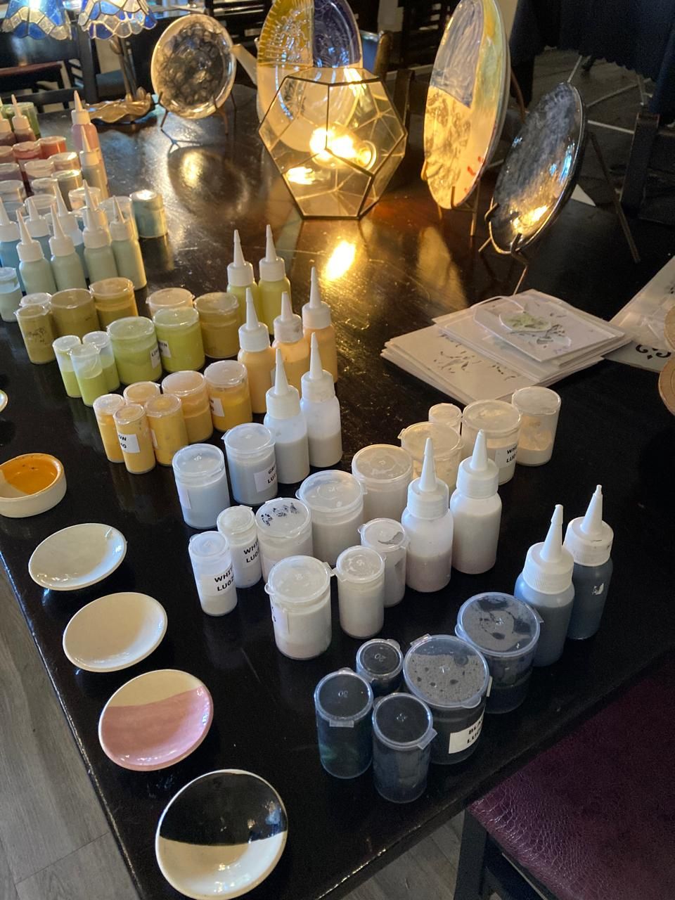 Rows of glaze colours with sample dishes